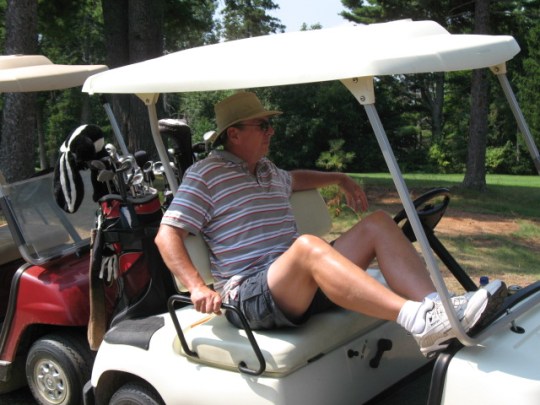 Satch taking it easy in the cart.