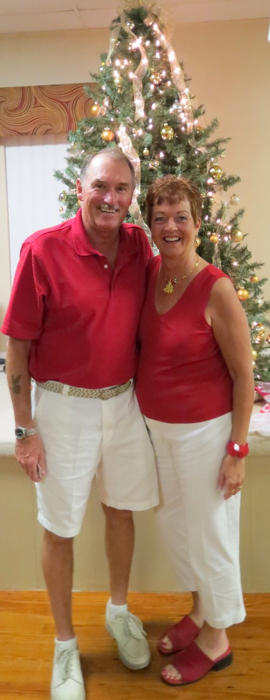 At the hall in front of the tree on the stage!